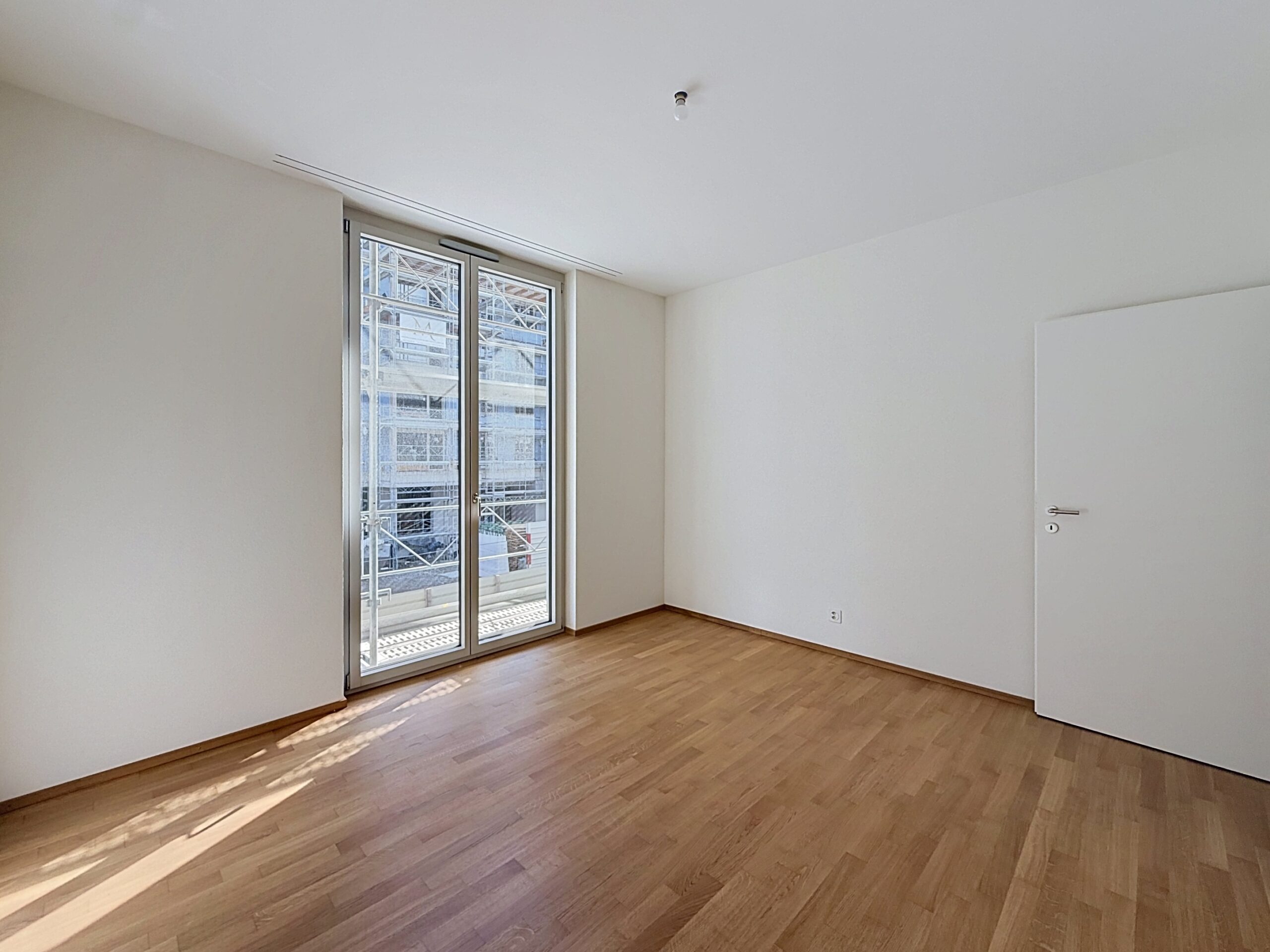 Chambre d’un appartement Urbano avec accès au balcon